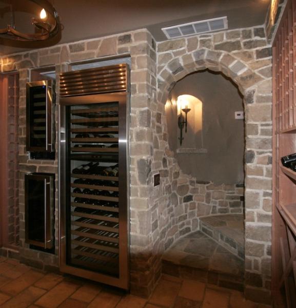 Wine cellar with roof tile floor and stone veneer walls